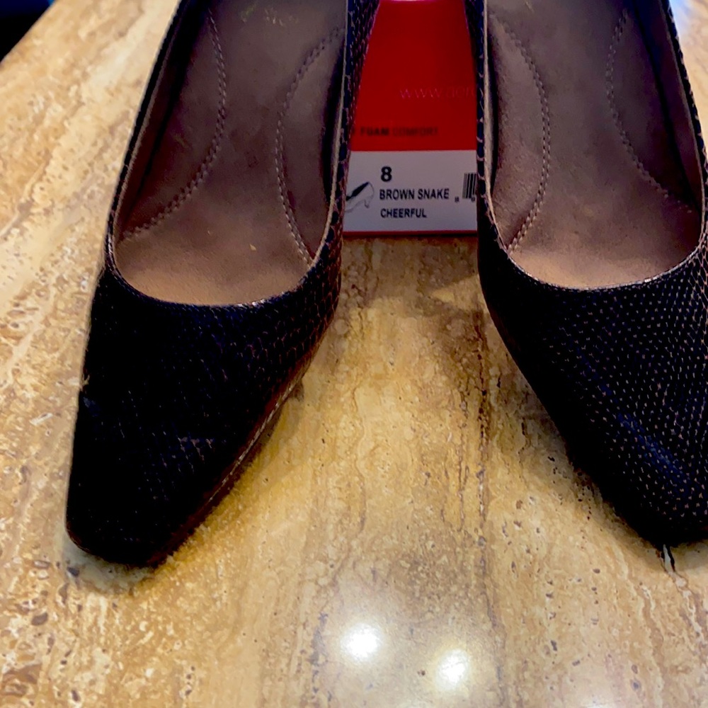 Aerosol ladies brown snake cheerful pump with heel rest design. Used